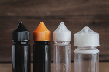 Vape liquid plastic bottle packaging . bottle vape with a white and black blank .