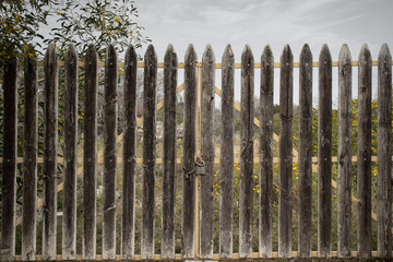 Fototapeta premium Gate closed and locked with padlock. Dramatic picture concept world closed. world lock down
