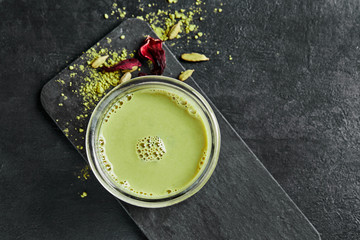 Homemade matcha green tea on stone background
