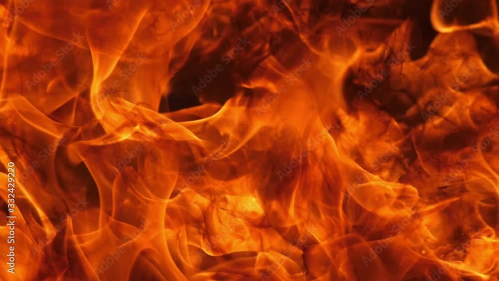 Wall mural slow motion speed close up scene of moving burning pattern as background. hot as inferno flame conce