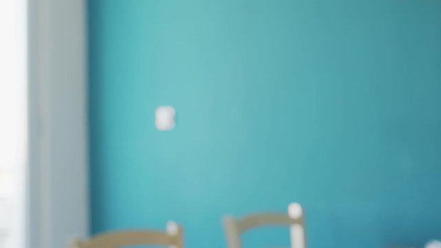Caucasian cute girl imitating playing karate kung fu martial arts indoors feeling positive and smiling
