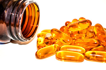 Omega 3 fish oil softgel capsules isolated on white background