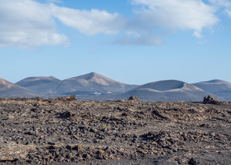 Fototapeta na wymiar Volcanic landscape of Timanfaya National Park on island Lanzarote