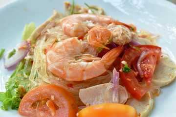 glass noodle with shrimp and minced pork spicy salad on plate 