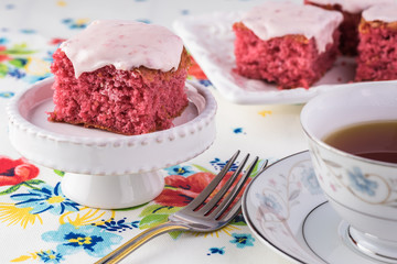Homemade strawberry sheetcake with strawberry frosting.