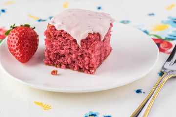 Homemade strawberry sheetcake with strawberry frosting.