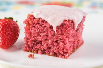 Homemade strawberry sheetcake with strawberry frosting.