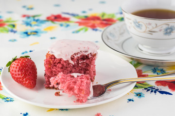 Homemade strawberry sheetcake with strawberry frosting.