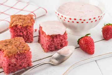 Homemade strawberry sheetcake with strawberry frosting.