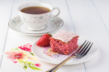 Homemade strawberry sheetcake with strawberry frosting.