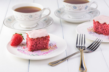 Homemade strawberry sheetcake with strawberry frosting.