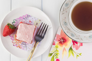 Homemade strawberry sheetcake with strawberry frosting.