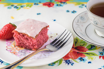 Homemade strawberry sheetcake with strawberry frosting.