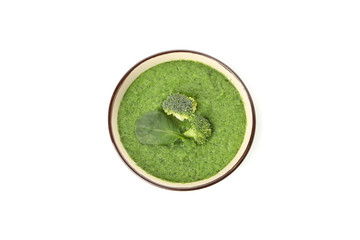 Bowl with broccoli soup isolated on white background