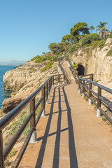 View of walking trail in "Cantal's Cliff" next to Mediterranean sea in "Cala of Moral". Malaga. Spain.