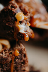 Homemade chocolate brownie with caramel drop. Macro close up