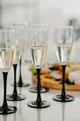 Glasses with sparkling wine with blurry background. Party
