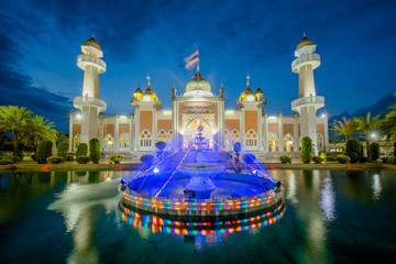 Fototapeta na wymiar Beautiful Pattani Central Mosque and reflection in water recognized as a special tourist attraction.southern, Thailand.(Translate Thai and Arab text in image is name of the central mosque of Pattani)