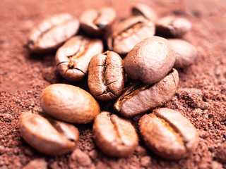 pile of ground coffee beans and powder