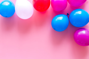 Decorative frame with colorful balloons on pink background top-down frame copy space