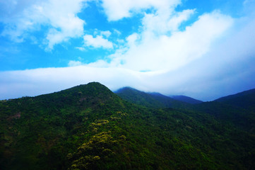 Fototapeta na wymiar green mountains and blue sky