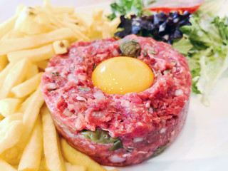 tasty Steak tartare (Raw beef) - classic steak tartare on white plate