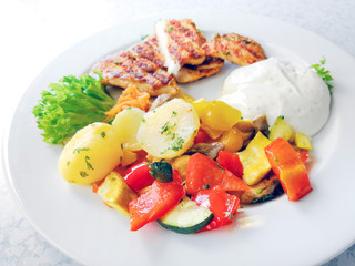 Fresh chicken steak with tomatoes and potatoes