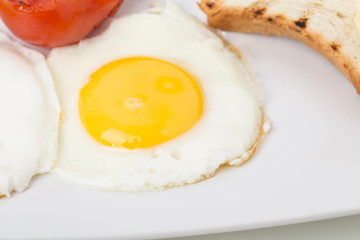 Fragment of english breakfast with the egg.
