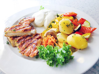 Fresh chicken steak with tomatoes and potatoes