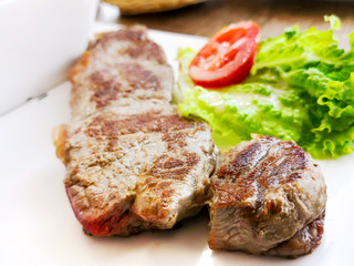 juicy steak beef meat with tomato and french fries