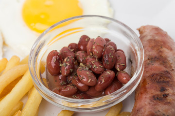 Fragmnet of the breakfast with beans in bowl.