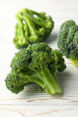 Broccoli on wooden background, close up. Healthy food