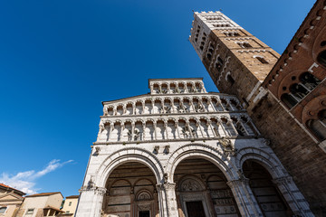 Fototapeta premium Lucca, facade and bell tower of the Cathedral of San Martino (Saint Martin), in Romanesque Gothic style, XI century. Tuscany, Italy, Europe