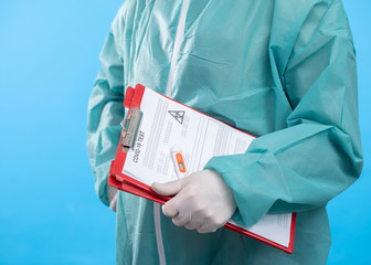Doctor holding test tube with Positive Coronavirus or Covid-19 test blood sample - Concept of...