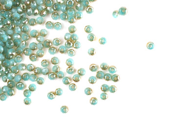 close up multi colored beads heap isolated on white