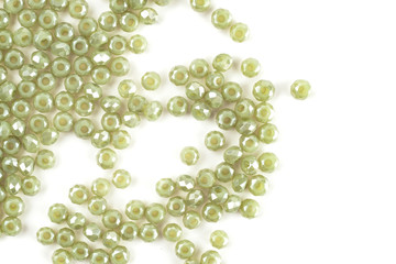 close up multi colored beads heap isolated on white