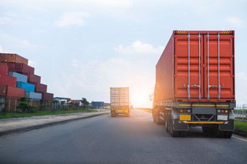 Back view of Red Container truck in ship port Logistics.Transportation industry in port business...