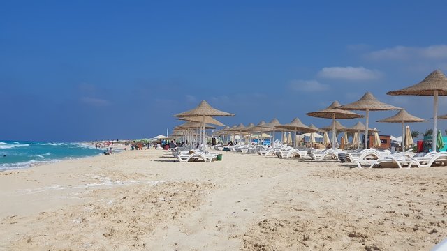 Sun set on the beach in Egypt north coast / dahab / hurgada / sharm el sheikh / taba / alexandria  - best place for vacation under umbrella  - holiday relaxation beach sand inspiration happiness  tan.