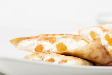 Pancakes stuffed with cottage cheese and raisins.