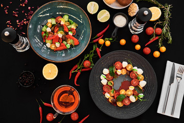 Appetizing food laid out on a black background. Food photography for restaurant menu
