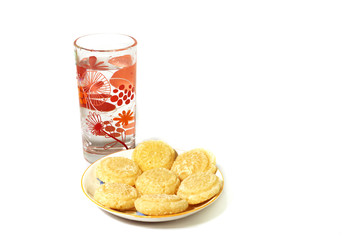 plate of Indian traditional sweets Pada or burfi which is made by cow milk served with a glass of drinking water