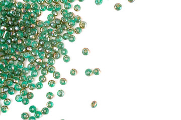 close up multi colored beads heap isolated on white