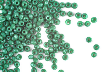 close up multi colored beads heap isolated on white