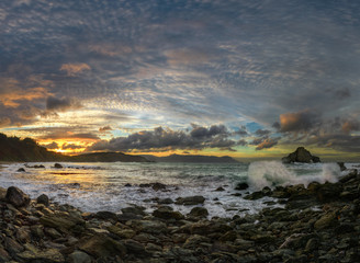 Rocky Waves Beach at Sunset