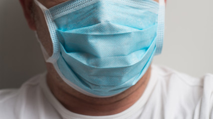Closeup of doctor wearing medical mask to protect against the corona virus
