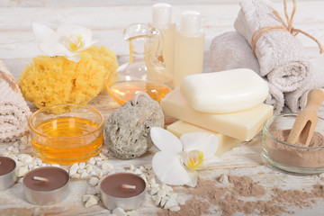 Fototapeta na wymiar home spa, candles, pumice, natural soap, dry powder for making a face mask,