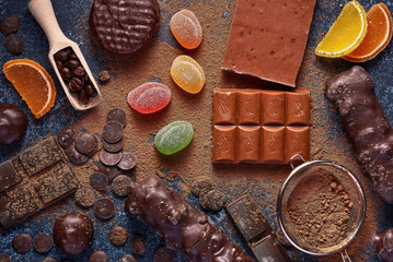 Chocolate and marmalade candys on blue background