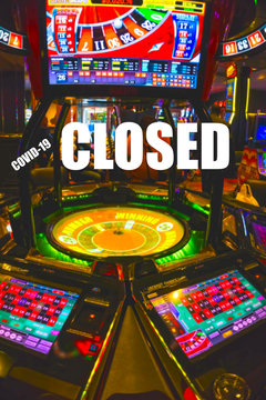 Conceptual image about casino closed stop sign indicating warning of Coronavirus