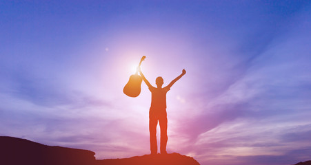 Silhouette of guitarist playing guitar and successful guitarist Silhouette concept