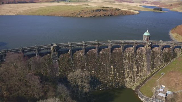 Aerial view of Craig goch elan valley. flying over dam white panning right